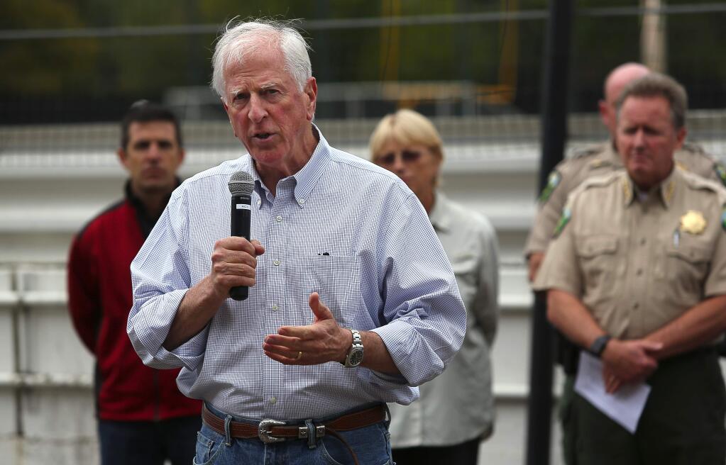 Congressman Mike Thompson addresses the crowd during an update on the Valley fire, at the evacuation center, at the Napa County Fairground, in Calistoga, on Monday, September 14, 2015. (Christopher Chung/ The Press Democrat)