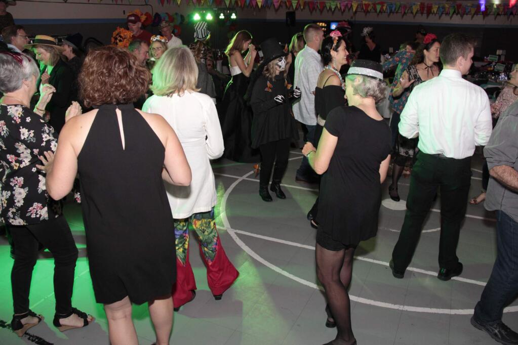 Everyone enjoying the dancing at the Mad Hatter Ball held on November 16, 2019 at the Mentor Me Cavanagh Center in Petaluma CA.JIM JOHNSON for the Argus Courier.