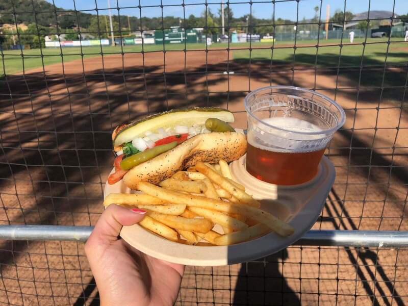Baseball: It's not just peanuts and Crackerjack anymore. Now there are gourmet hot dogs and burgers, garlic fries and local IPA. Oh, and compostable plates. (Photo by Rachel Hundley)