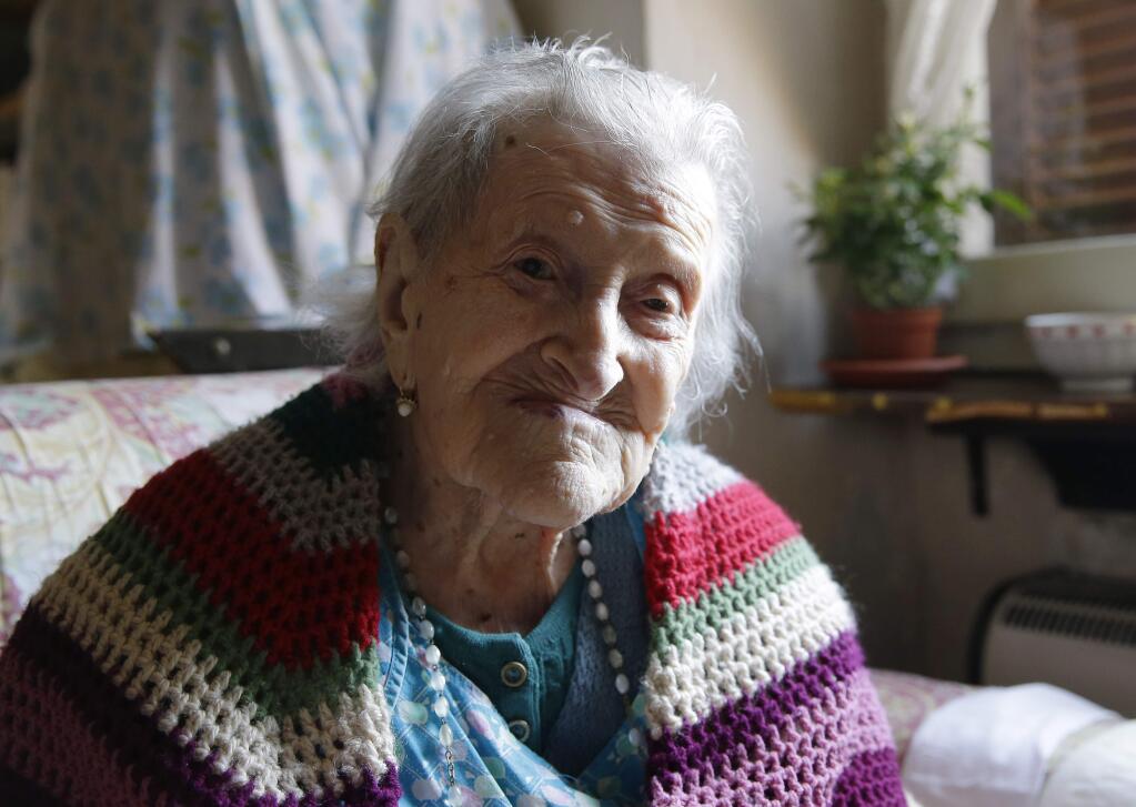 Emma Morano, 117 as of November 2016, sits in her apartment in Verbania, Italy, in this photo taken Friday, June 26, 2015. Morano and Susannah Mushatt Jones, also 115 at the time of the photo, of the Brooklyn borough of New York, were believed to be the last two people in the world with birthdates in the 1800s. (AP Photo/Antonio Calanni)