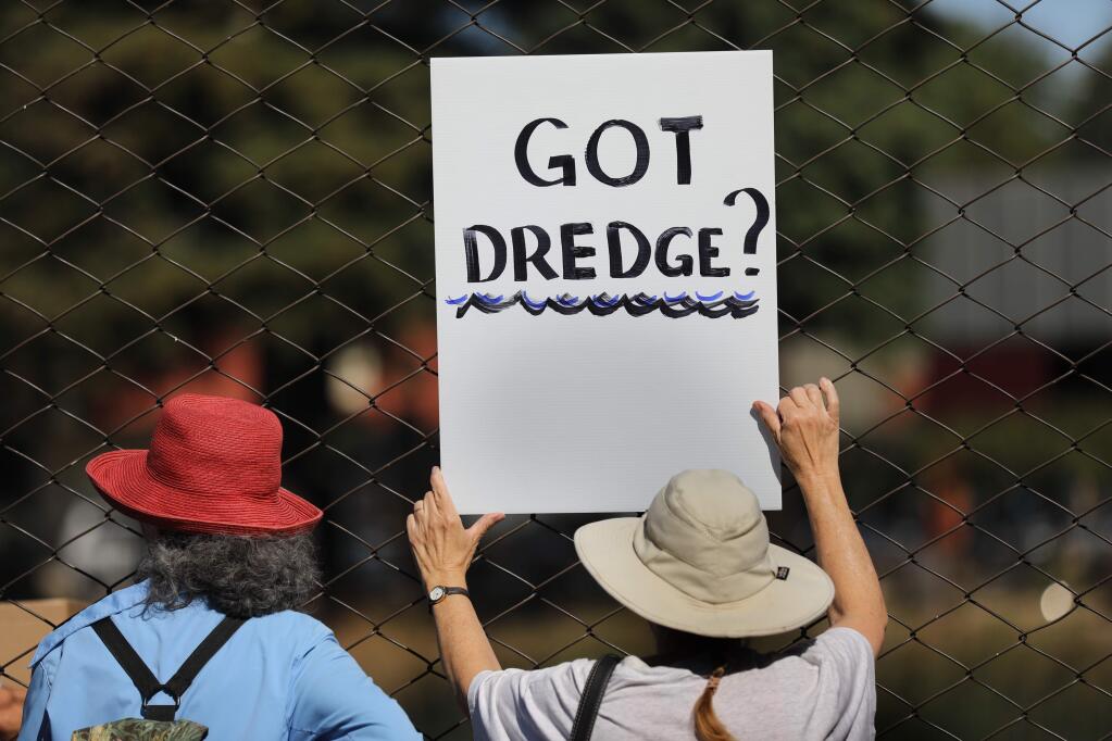 Petaluma River dredging supporters hold up signs during a visit by the regional commander of the U.S. Army Corps of Engineers. (BETH SCHLANKER / The Press Democrat, 2019)