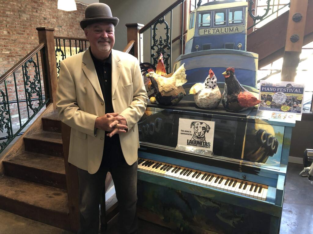 PLAYING PIANOS - Petaluma Pete (John Maher) at the Great Petaluma Mill, with a piano painted by Wendy Brayton.