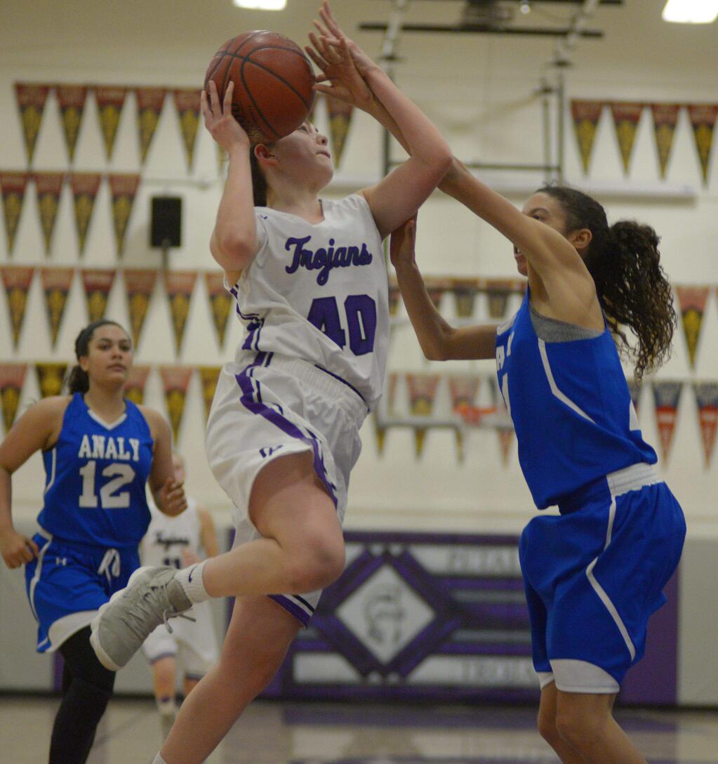 SUMNER FOWLER/FOR THE ARGUS-COURIERPetaluma's Sheriene Arkat goes hard to the basket in game against El Molino. Arkat returns after leading the T-Girls in scoring last season.