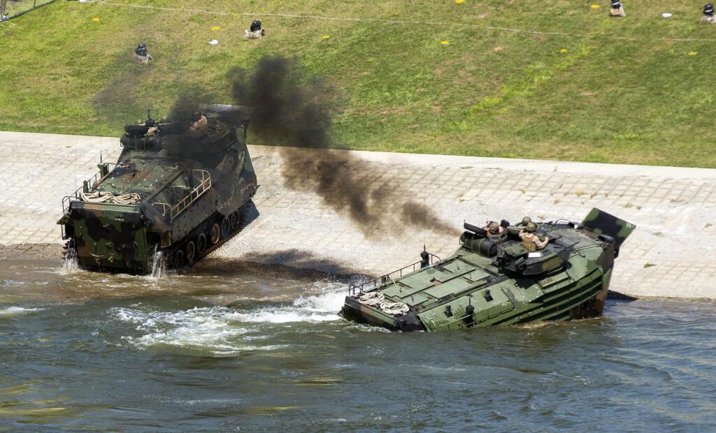 This Sept. 6, 2016, photo released by the U.S. Marine Corps shows Marines with the 2nd Amphibious Assault Battalion aboard AAV-7 Amphibious Assault vehicles during an exercise on the Cumberland River in Nashville, Tenn. The Marine Corps said Wednesday, Sept. 13, 2017 that an AAV-7 similar to these one caught fire during a training exercise at Camp Pendleton, Calif., and 15 Marines were taken to area hospitals, including several with serious injuries. (Lance Cpl. Jered Stone/U.S. Marine Corps via AP)