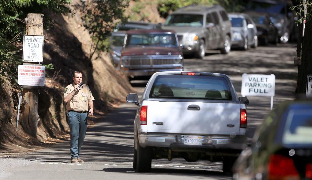 The entrance to the Bohemian Grove encampment in Monte Rio is busy with traffic, Friday July 17, 2015. (Kent Porter / Press Democrat) 2015