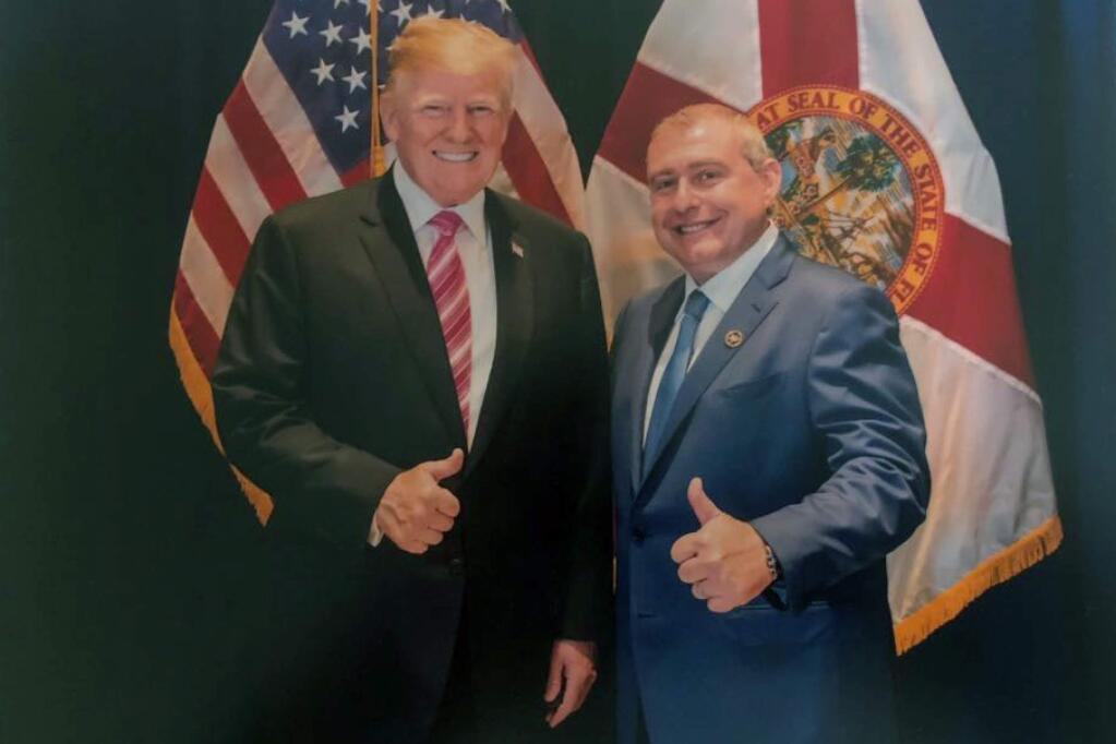This undated image released by the House Judiciary Committee from documents provided by Lev Parnas to the committee in the impeachment probe against President Donald Trump, shows a photo of Lev Parnas with Trump in Florida. Parnas, a close associate of Trump's personal lawyer Rudy Giuliani is claiming Trump was directly involved in the effort to pressure Ukraine to investigate Democratic rival Joe Biden. Trump on Thursday, Jan. 16, 2020, repeated denials that he is acquainted with Parnas, despite numerous photos that have emerged of the two men together. (House Judiciary Committee via AP)