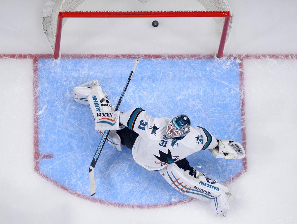San Jose Sharks goalie Antti Niemi, of Finland, is scored on by Los Angeles Kings center Tyler Toffoli during the first period of a game, Saturday, Dec. 27, 2014, in Los Angeles. (AP Photo/Mark J. Terrill)