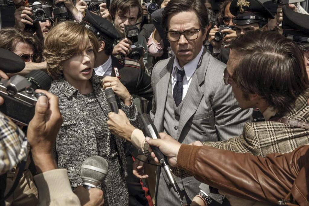 FILE - This image released by Sony Pictures shows Michelle Williams, left, and Mark Wahlberg in TriStar Pictures' 'All The Money in the World.' After an outcry over a significant disparity in pay with Williams, Wahlberg has agreed to donate the $1.5 million he earned for reshoots on the movie to the anti-sexual misconduct initiative Time's Up, in Williams' name, announced Saturday, Jan. 13, 2018. (Fabio Lovino/Sony-TriStar Pictures via AP)