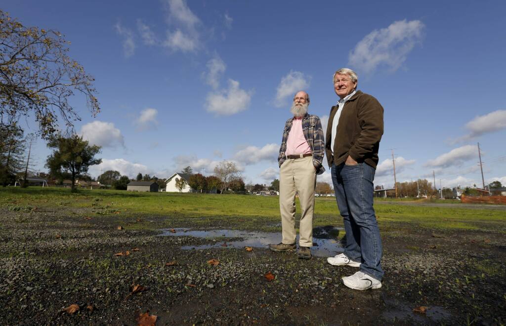 John Creager, left, and Paul O'Rear, members of the First United Methodist Church of Santa Rosa's Homeless Ministries Task Force committee, stand in the space on Giffen Ave which will be used for a temporary housing community for the homeless. Photo taken in Santa Rosa, on Wednesday, November 23, 2016. (BETH SCHLANKER/ The Press Democrat)
