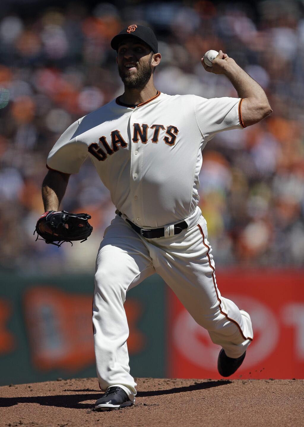 San Francisco Giants pitcher Madison Bumgarner works against the Atlanta Braves in the first inning of a baseball game Sunday, Aug. 28, 2016, in San Francisco. (AP Photo/Ben Margot)