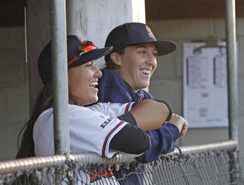 Bill Hoban/Index-TribuneKelsie Whitmore, left, and Stacy Piagno share a light moment during Friday night's Sonoma Stompers-San Rafael Pacifics' game. Whitmore started in left field for the Stompers while Piagno was the starting pitcher in the Friday, July 1, game against the San Rafael Pacifics.