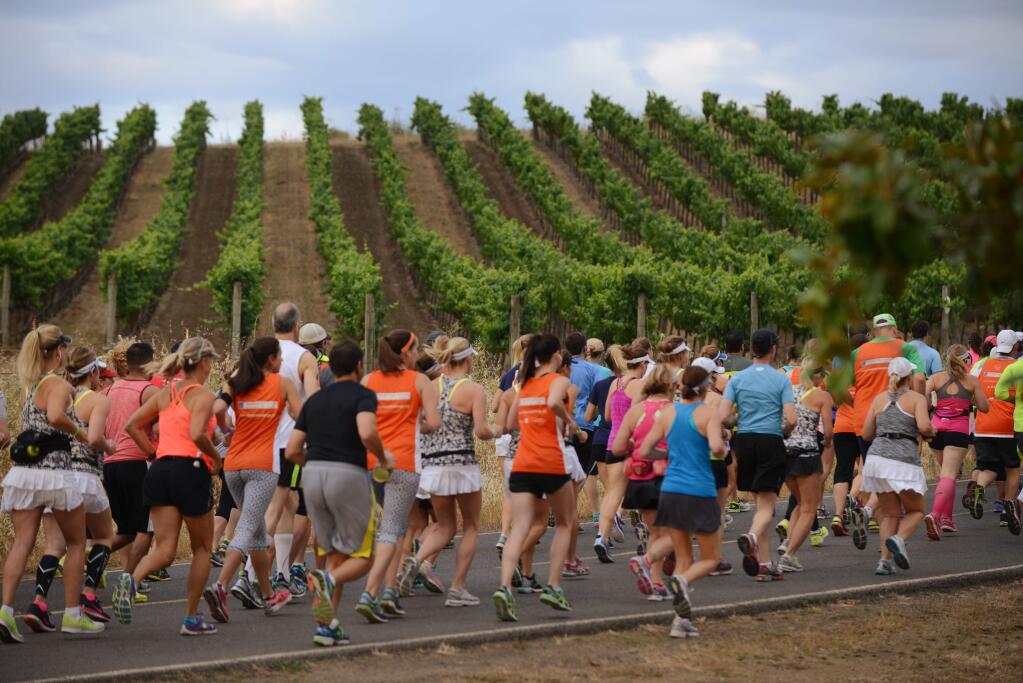 Runners in the 2015 Napa to Sonoma Wine Country Half Marathon in 2015. The event returns, followed by a Post-Race Wine Festival, to the Sonoma Plaza on Sunday. (ERIK CASTRO/ FOR THE PRESS DEMOCRAT)