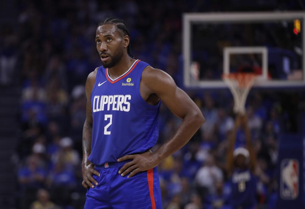Los Angeles Clippers' Kawhi Leonard looks at the scoreboard during the first half of the team's NBA basketball game Golden State Warriors on Thursday, Oct. 24, 2019, in San Francisco. (AP Photo/Ben Margot)