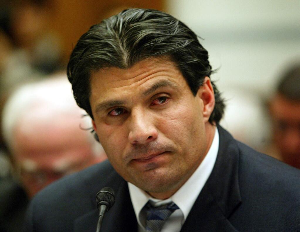 In this March 17, 2005 file photo, former Oakland Athletic and Texas Ranger baseball player Jose Canseco testifies on Capitol Hill in Washington, to examine the use of steroids in baseball. (AP Photo/Gerald Herbert, file)