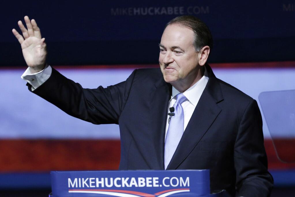 Former Arkansas Gov. Mike Huckabee waves to supporters in Hope, Ark., Tuesday, May 5, 2015, after he announced that he is running for the Republican presidential nomination. Huckabee pitched himself as the best GOP candidate to take on Democratic favorite Hillary Rodham Clinton. (AP Photo/Danny Johnston)