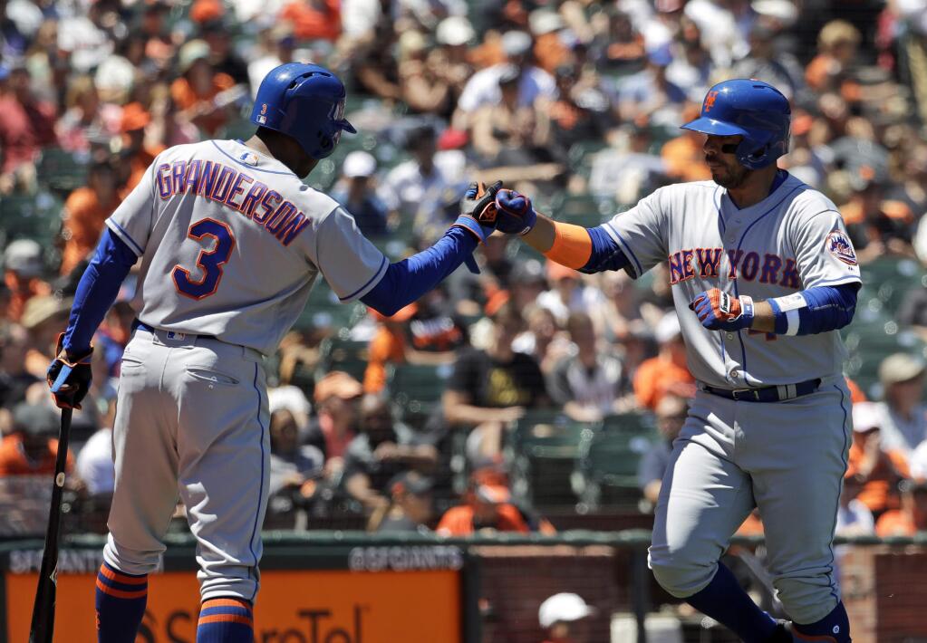 New York Mets' Rene Rivera, right, is met at the plate by teammate Curtis Granderson after hitting a solo home run against the San Francisco Giants during the fourth inning of a baseball game Sunday, June 25, 2017, in San Francisco. (AP Photo/Marcio Jose Sanchez)