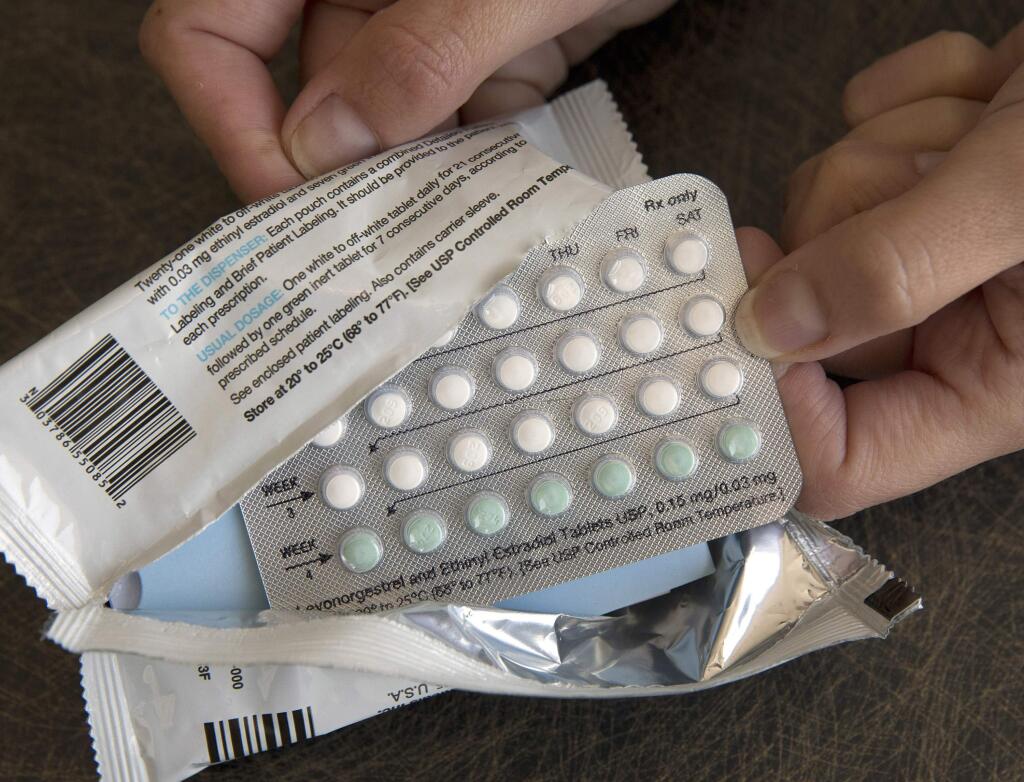 FILE - In this Aug. 26, 2016, file photo, a one-month dosage of hormonal birth control pills is displayed in Sacramento, Calif. A U.S. appeals court Thursday, Dec. 13, 2018, blocked rules by the Trump administration allowing more employers to opt out of providing women with no-cost birth control. (AP Photo/Rich Pedroncelli, File)