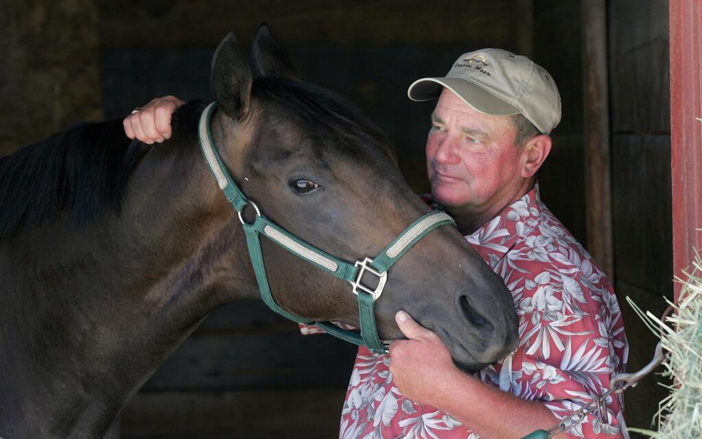 7/29/2008: A1: Trainer Steve Specht, with 2-year-old filly Flyin Kim at the Sonoma County Fair barns on Saturday, thinks the racing board has gone overboard with regulations regarding steroid use. But a month into the new rules, he says he is adjusting. PC: Trainer Steve Specht with two year-old philly 'Flyin Kim' at the Sonoma County Fair barns, Saturday July 26, 2008. (Kent Porter / The Press Democrat)2008