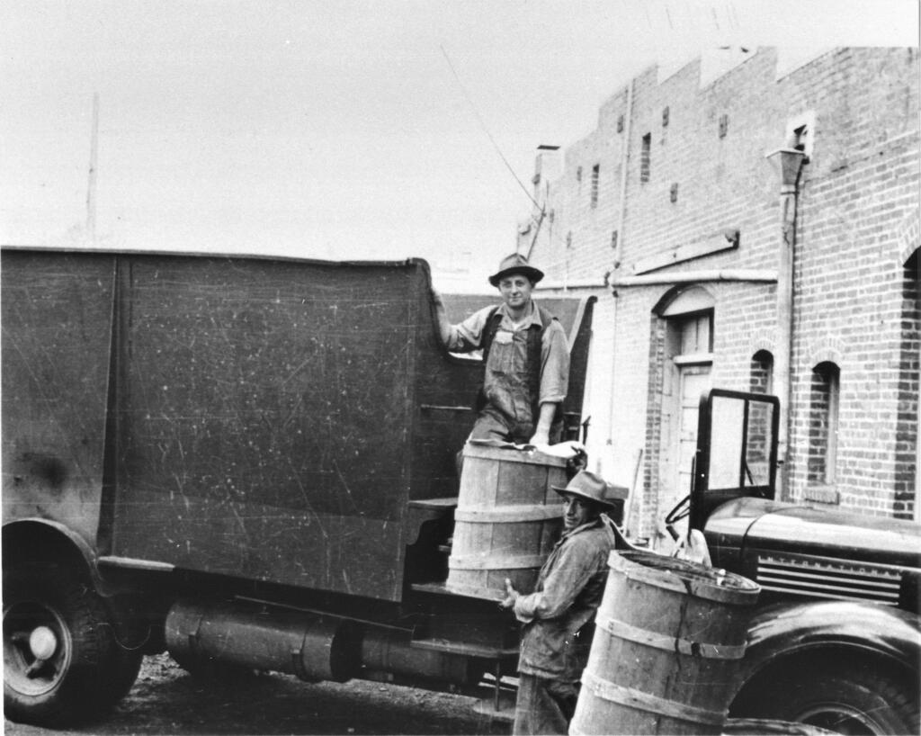 Adolph Calegari (on truck) and Jim Varni collecting garbage in Petaluma, about 1937. The photo was taken behind the Argus Courier offices which at the time were located on Keller Street. (Courtesy of the Sonoma County Library)