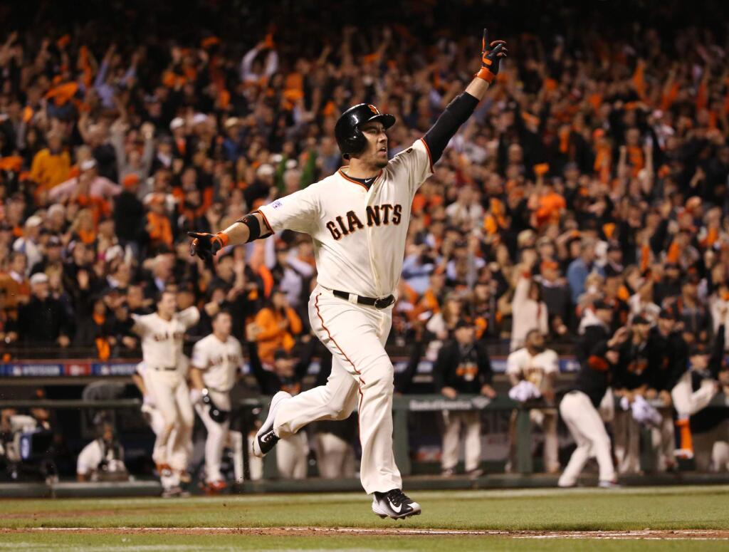San Francisco Giants' Travis Ishikawa reacts after hitting a walk-off three-run home run in the ninth inning against the St. Louis Cardinals in Game 5 of baseball's NL Championship Series, Thursday, Oct. 16, 2014, in San Francisco. The Giants won 6-3, and advanced to the World Series. (AP Photo/St. Louis Post-Dispatch, Chris Lee)