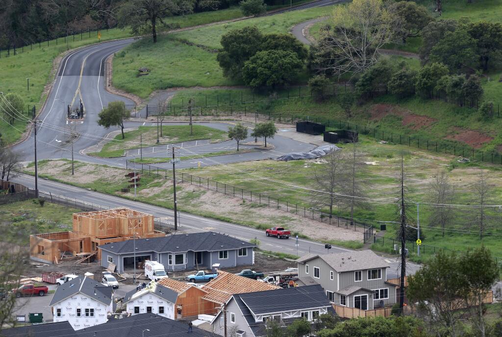 A truck drives along Parker Hill Road past the campus of the former Hidden Valley Satellite school, on the right, in Santa Rosa on Thursday, April 11, 2019. (BETH SCHLANKER/ The Press Democrat)