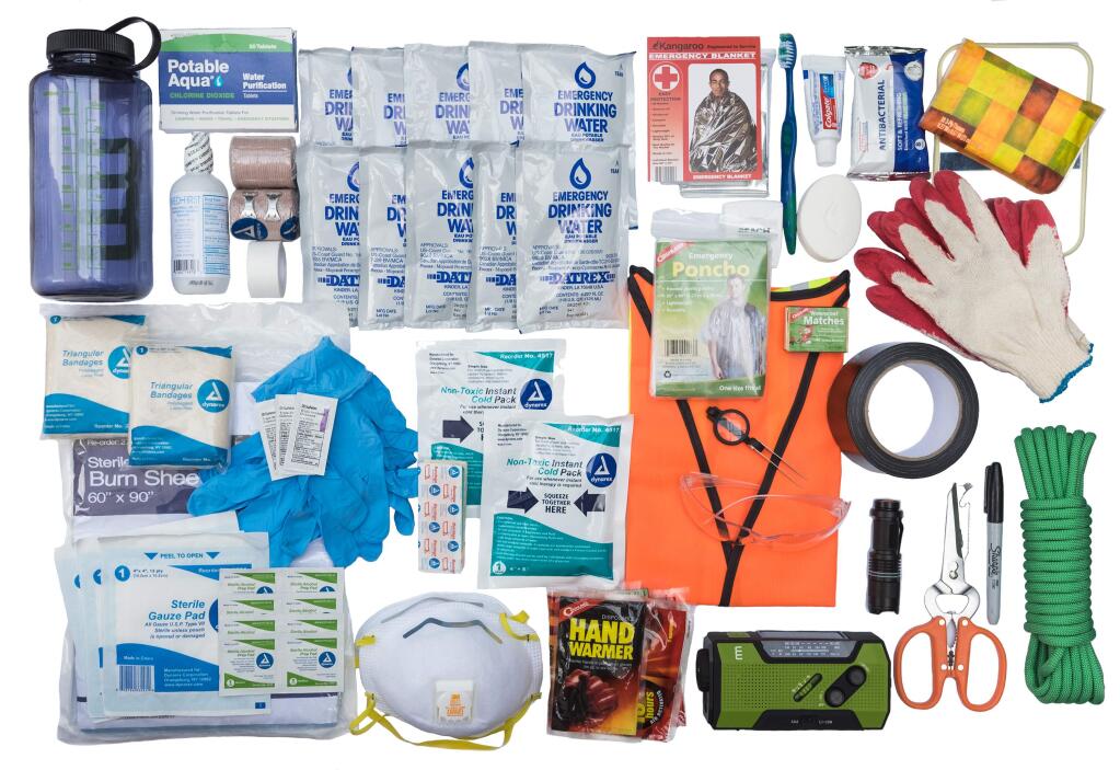 This June 2018 photo provided by VLES shows contents of the company's GO-bag. The bag is a best-in-class fully-stocked emergency bag that has things you could need in case of an emergency and has plenty of room for the personal items you'll need. (VLES via AP)