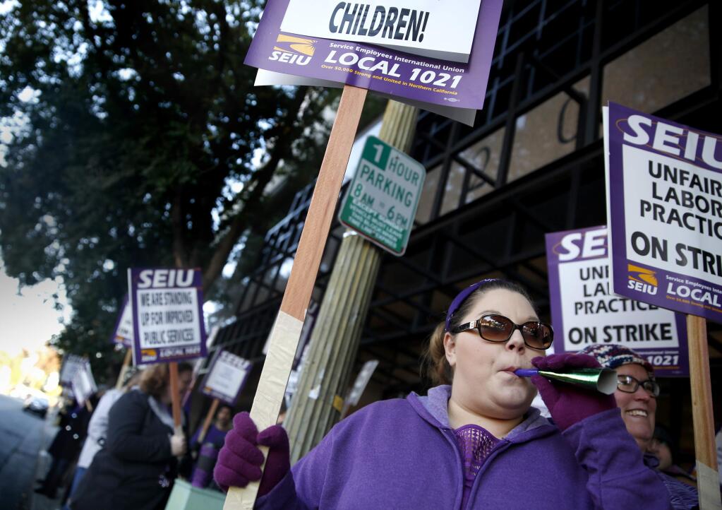 Christina Straub strikes with members of Service Employees Union Local 1021 in Santa Rosa, on Tuesday, Nov. 17, 2015. (BETH SCHLANKER/ PD)