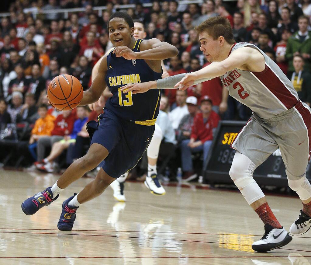 Cal guard Charlie Moore (13) drives against Stanford guard Robert Cartwright (2) during the second half Friday, Feb. 17, 2017, in Stanford. Stanford won 73-68. (AP Photo/Tony Avelar)
