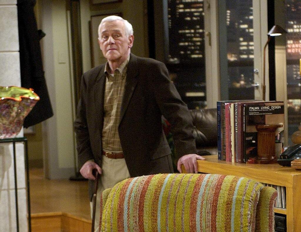 FILE - In this March 23, 2004 file photo, John Mahoney, who stars as Martin Crane, appears on the set during the filming of the final episode of 'Frasier' in Los Angeles. Mahoney's longtime manager, Paul Martino, said Mahoney died Sunday, Feb. 4, 2018, in Chicago after a brief hospitalization. The cause of death was not immediately announced. He was 77. (AP Photo/Reed Saxon, File)