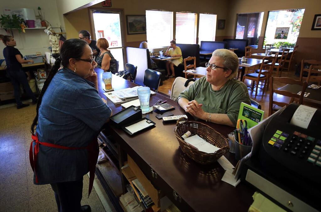 Singletree Cafe co-owners Nanci Van Praag, right, and Dolores Rodriguez wait for customers, on Monday June 26, 2017. (Kent Porter / Press Democrat) 2017