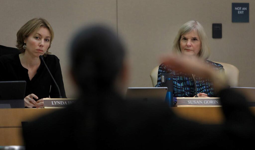 Supervisors, Lynda Hopkins and Susan Gorin at a Board of Supervisors meeting in February. Hopkins plans to ask her colleagues to swith the county to a 100 percent renwable energy plan. (KENT PORTER / The Press Democrat)