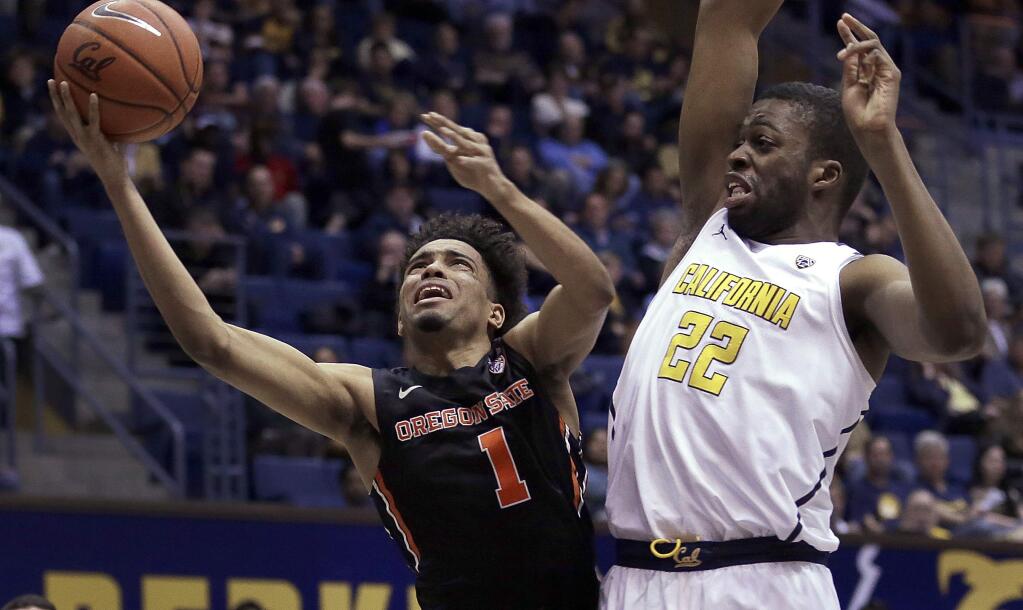 Oregon State's Stephen Thompson Jr., left, shoots against California's Kingsley Okoroh during the first half of an NCAA college basketball game Friday, Feb. 24, 2017, in Berkeley, Calif. (AP Photo/Ben Margot)