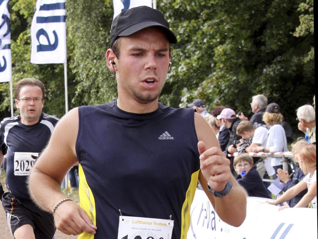 In this Sunday, Sept. 13, 2009 photo Andreas Lubitz competes at the Airportrun in Hamburg, northern Germany. Germanwings co-pilot Andreas Lubitz appears to have hidden evidence of an illness from his employers, including having been excused by a doctor from work the day he crashed a passenger plane into a mountain, prosecutors said Friday, March 27, 2015. The evidence came from the search of Lubitz's homes in two German cities for an explanation of why he crashed the Airbus A320 into the French Alps, killing all 150 people on board. (AP Photo/Michael Mueller)