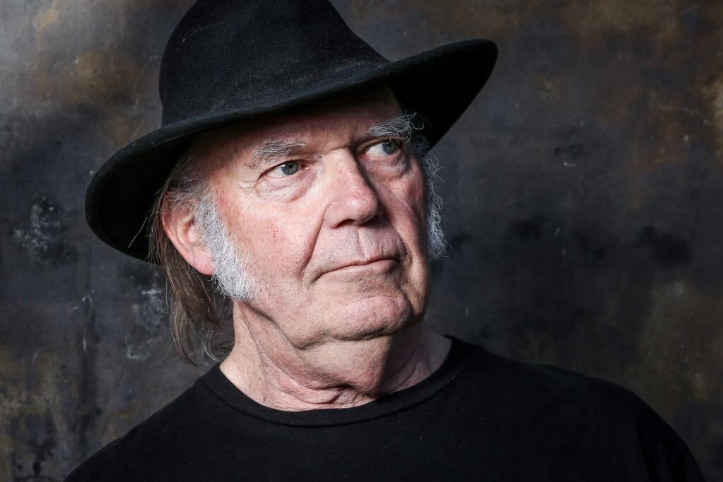 In this May 18, 2016 photo, Neil Young poses for a portrait in Calabasas to promote his new album, 'Earth.' The album is a collection of 13 live songs interspersed with the sounds of crickets, frogs, crows, bees and other animals Young recorded in his backyard. (Rich Fury/Invision/AP)