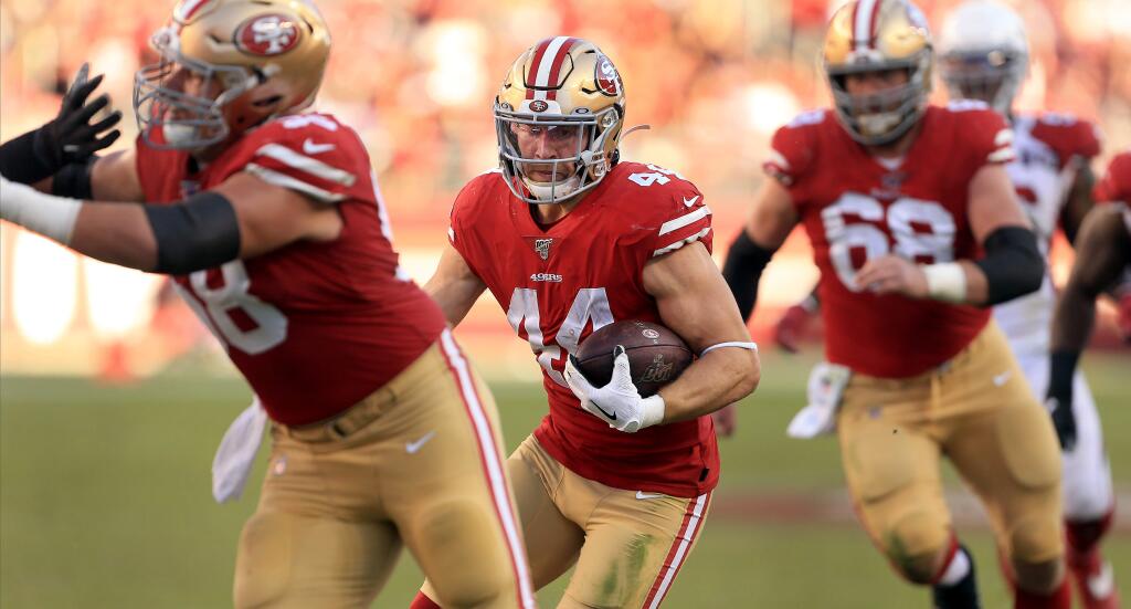 Kyle Juszczyk rips for a first down during San Francisco's 36-26 win over Arizona, Sunday, Nov. 17, 2019 in Santa Clara. (Kent Porter / The Press Democrat) 2019