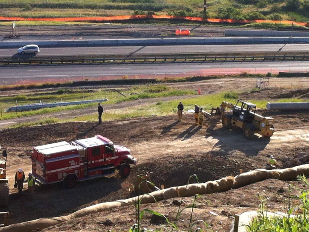 Emergency crews at a Petaluma construction site where a 28-year-old construction worker was killed southwest of the Petaluma Boulevard South exit of Highway 101 in Petaluma, on Wednesday, April 15, 2015. (BETH SCHLANKER/ The Press Democrat)