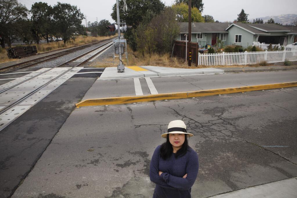 Petaluma, CA, USA. Monday, October 03, 2016._Jennifer Cho, 32, lives right next to a railroad crossing. She says the Smart train passes and blows its horn too loud and for too long, disturbing her and her family including her three-year-old son. (CRISSY PASCUAL/ARGUS-COURIER STAFF)