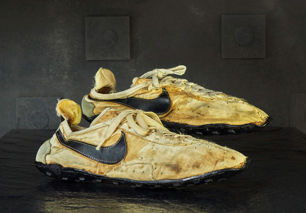 This undated photo provided by Graduate Hotels shows a pair of handmade Nike track shoes from the 1972 Olympic trials. The pair of Nike track shoes has sold for $50,000. (Christian Horan/Graduate Hotels via AP)