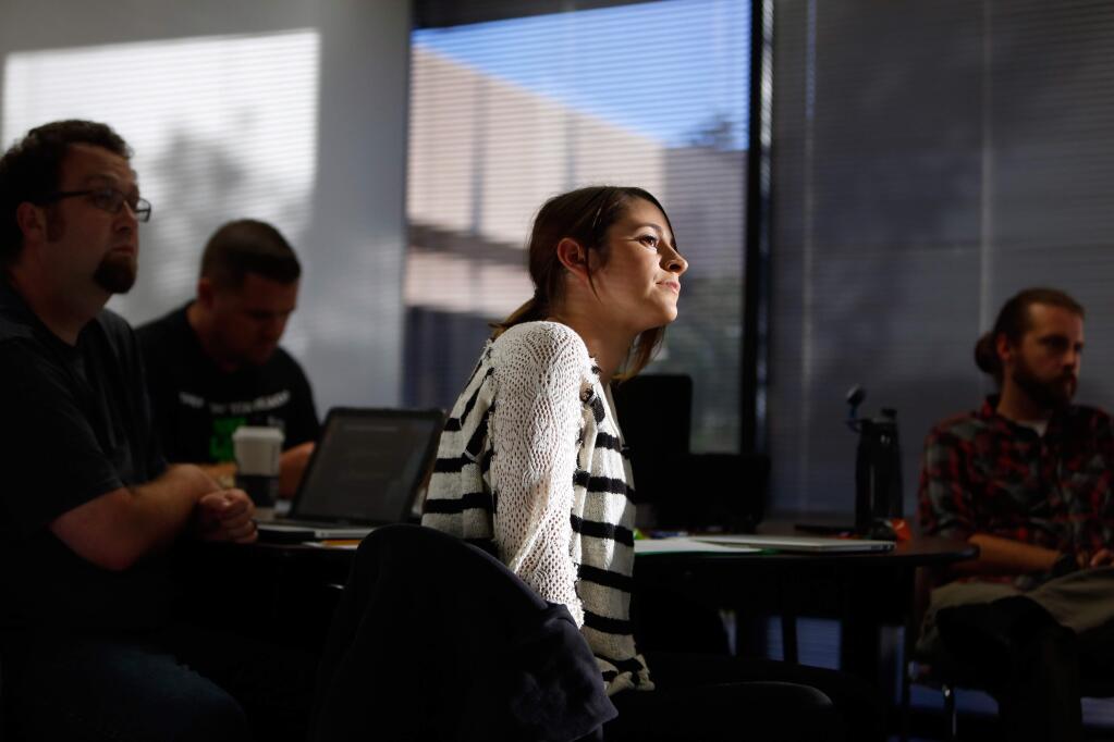 Briana Braverman, center, and other students listen intently to a lecture on special education laws, part of the teacher credentialing program by the Sonoma County Office of Education, in Santa Rosa, California on Thursday, September 29, 2016. Sonoma County currently fares better than other areas of California and the nation where there are serious shortages of teachers. (Alvin Jornada / The Press Democrat)