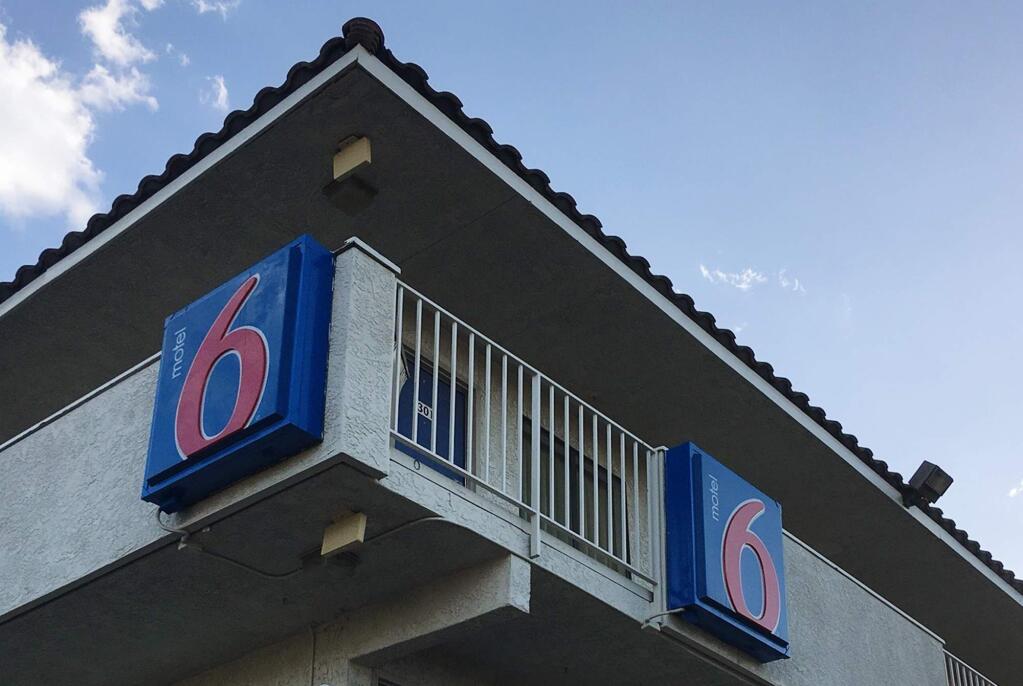 This photo shows a Motel 6 in Phoenix on Thursday, Sept. 14, 2017. Motel 6 says its employees in Phoenix will no longer work with U.S. Immigration and Customs Enforcement agents following news reports that its workers were reporting on guests they believed were in the United States illegally. (AP Photo/Anita Snow)