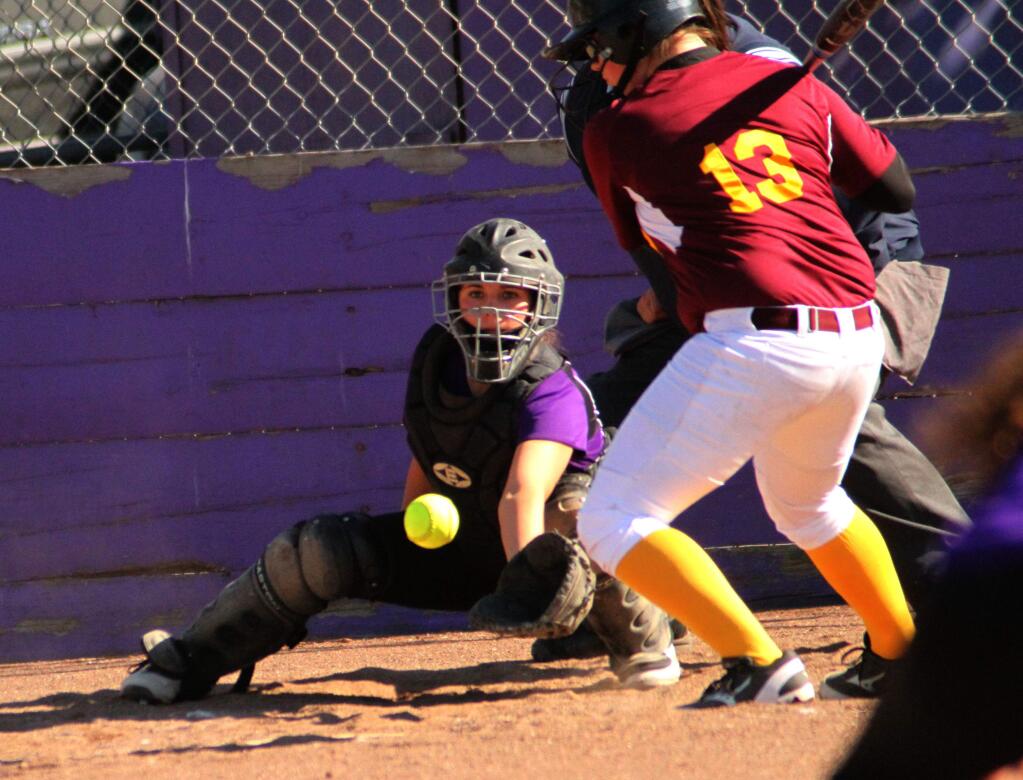 DWIGHT SUGIOKA/FOR THE ARGUS-COURIERPetaluma catcher Miranda Swanson grabs a low pitch during the T-Girls, 12-2 win over Piner.
