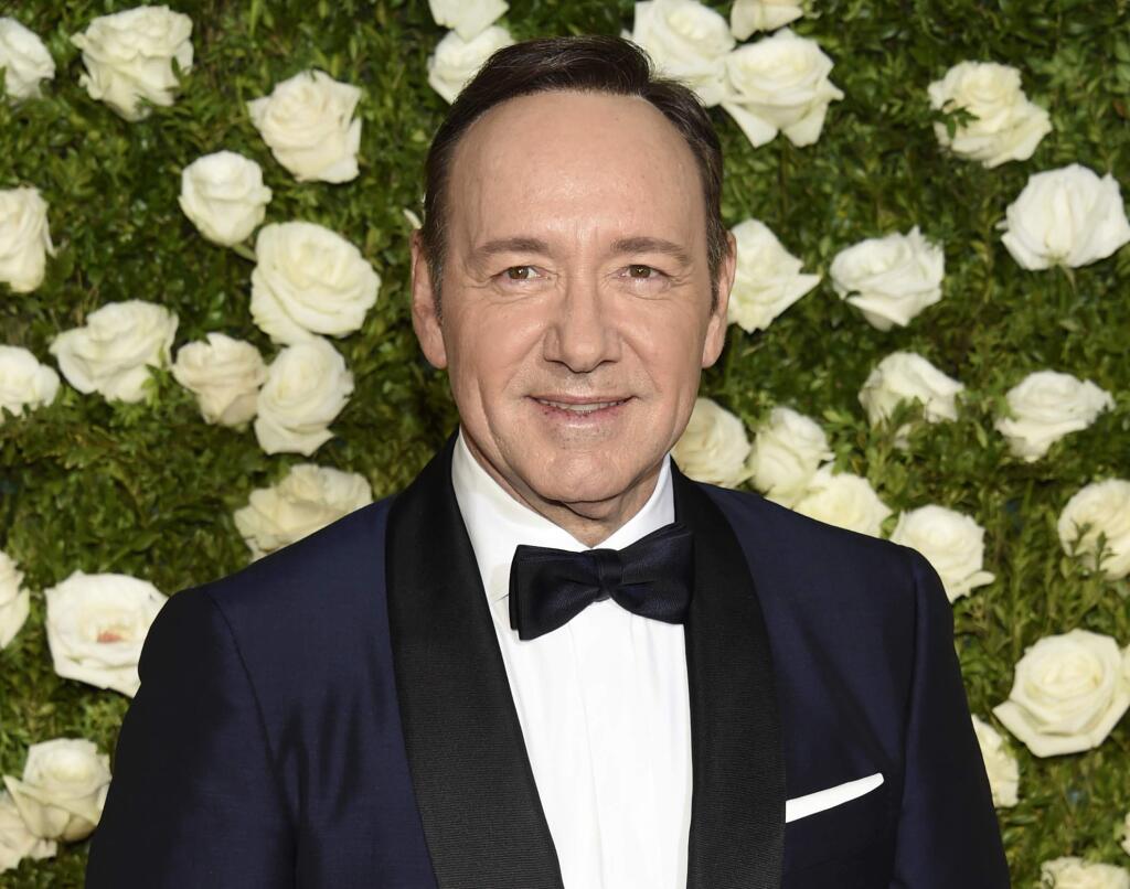 FILE - In this June 11, 2017 file photo, Kevin Spacey arrives at the 71st annual Tony Awards at Radio City Music Hall in New York. Production is resuming next year on the sixth and final season of 'House of Cards.' Taping of the political drama was halted in October amid sexual misconduct allegations against star Spacey. Netflix Chief Content Office Ted Sarandos told a conference Monday, Dec. 4, of the decision, Variety reported. Keep clicking for a list of more men accused of sexual harassment. (Photo by Evan Agostini/Invision/AP, File)