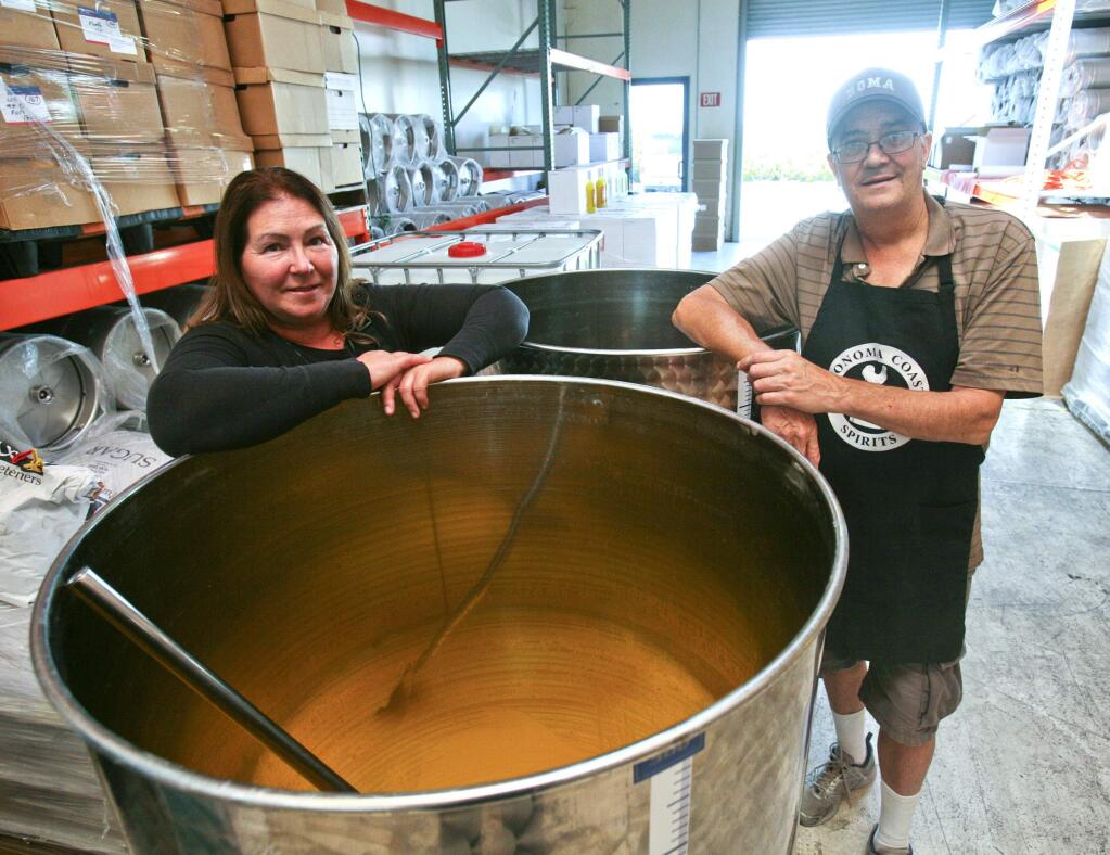 Jill and Doug Olson at their Sonoma Coast Spirits craft distillery in Petaluma on Monday, September 7, 2015. (SCOTT MANCHESTER/ARGUS-COURIER STAFF)