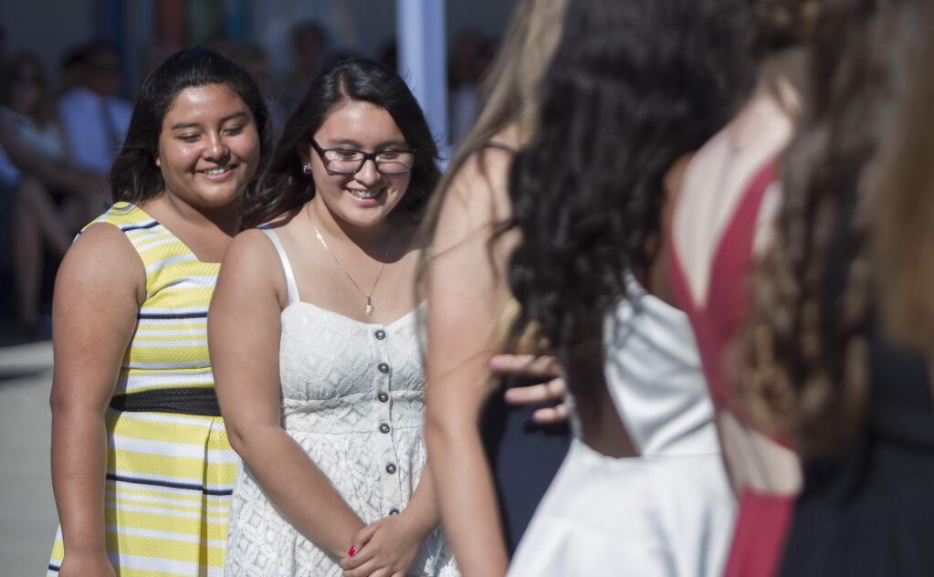 Adele Harrison Middle School’s dress code calls for straps to be at least 1.5 inches in length. Some students are saying the code unfairly targets girls. Above are Adele students at the eighth grade commencement in 2015. (Photos by Robbi Pengelly/Index-Tribune)
