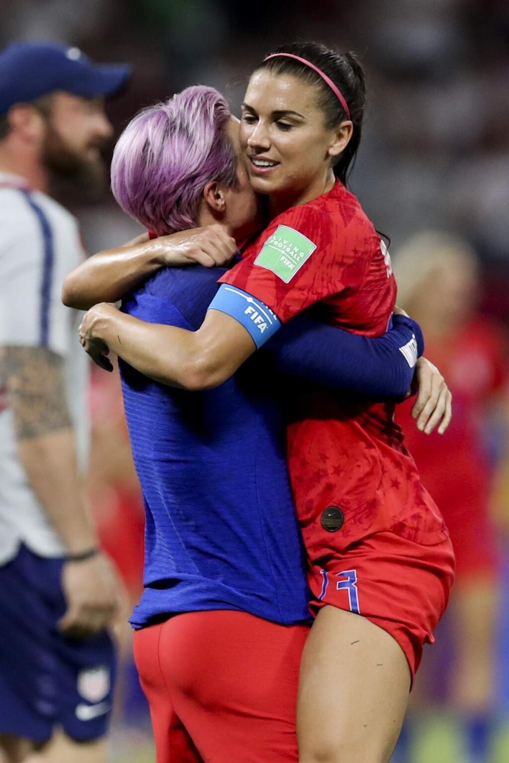 United States' Megan Rapinoe, left, celebrates with teammate Alex Morgan their team's victory against England after the Women's World Cup semifinal soccer match at the Stade de Lyon outside Lyon, France, Tuesday, July 2, 2019. (AP Photo/Francisco Seco)