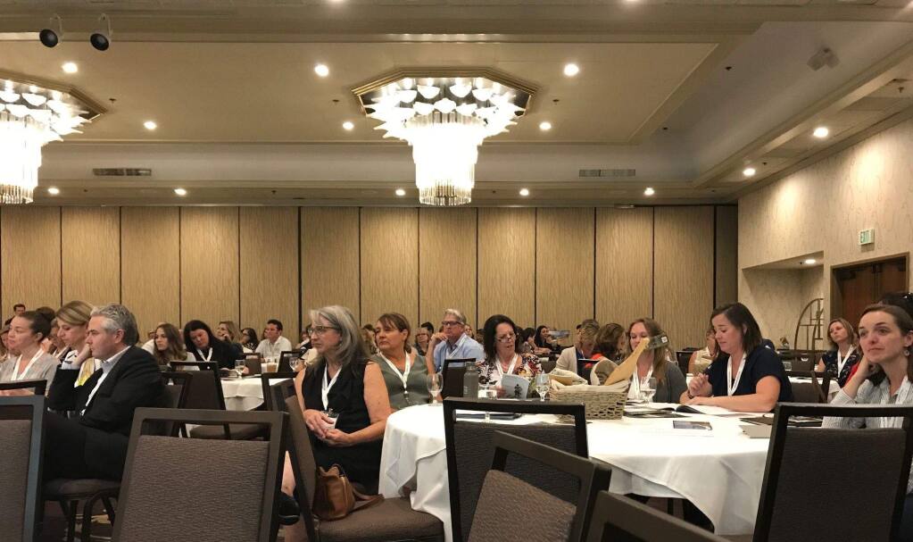 Attendees listen to presenters at Sonoma County Tourism's annual meeting, held Aug. 27 at DoubleTree Sonoma Wine Country Hotel in Rohnert Park. (Cheryl Sarfaty / North Bay Business Journal)