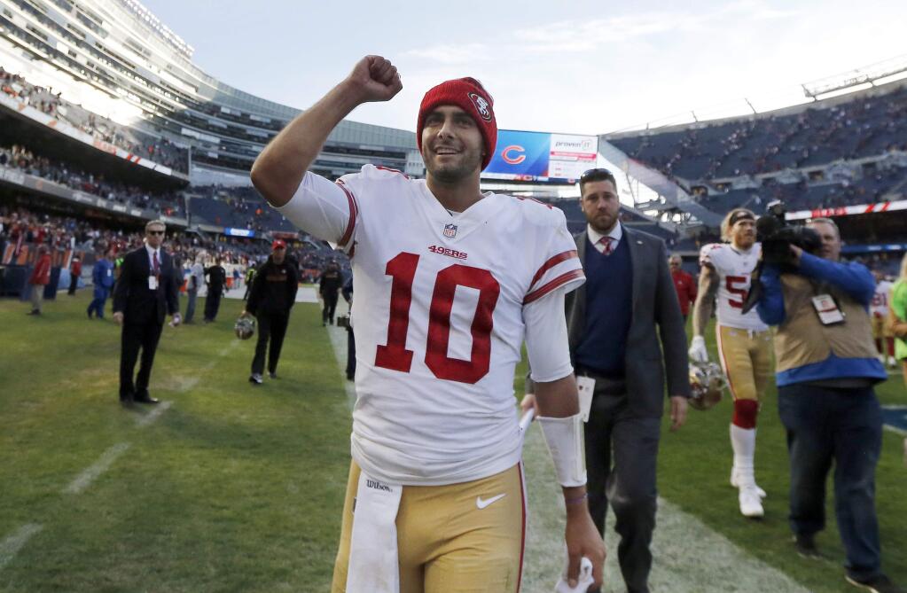 In this Sunday, Dec. 3, 2017, file photo, San Francisco 49ers quarterback Jimmy Garoppolo (10) celebrates after their 15-14 win against the Chicago Bears. Garoppolo looks to follow up a successful first start for the 49ers with another this week against Houston. (AP Photo/Charles Rex Arbogast, File)