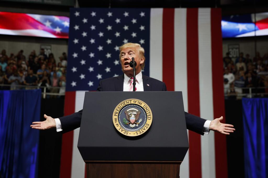 FILE - In this Friday, Sept. 22, 2017, file photo, President Donald Trump speaks at a campaign rally for Sen. Luther Strange, R-Ala., in Huntsville, Ala. Trump is expected to announce new restrictions on travel to the U.S. as his ban on visitors from six Muslim-majority countries sunsets Sunday, Sept. 24, 90 days after it went into effect. (AP Photo/Evan Vucci, File)