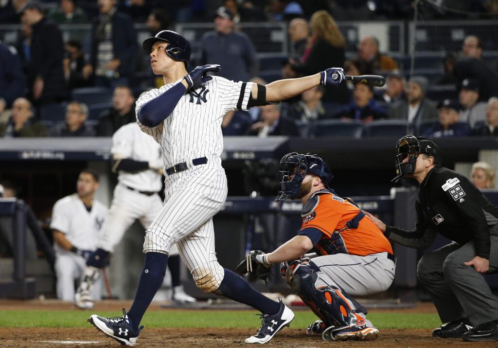 The New York Yankees' Aaron Judge hits a home run during the seventh inning of Game 4 of the American League Championship Series against the Houston Astros Tuesday, Oct. 17, 2017, in New York. (AP Photo/Kathy Willens)