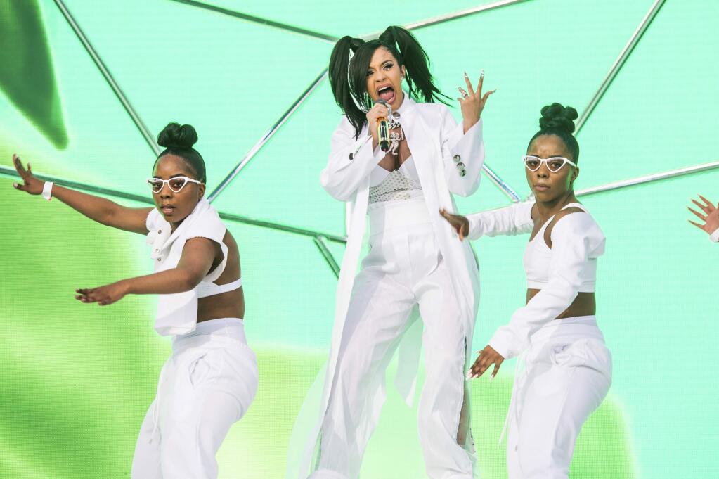 FILE - In this April 15, 2018 file photo, Cardi B performs at the Coachella Music & Arts Festival at the Empire Polo Club in Indio, Calif. A list of nominees in the top categories at the 2019 Grammys, including Kendrick Lamar, who is the leader with eight nominations, were announced Friday, Dec. 7, 2018, by the Recording Academy. Drake, Cardi B, Brandi Carlile, Childish Gambino, H.E.R., Lady Gaga, Maren Morris, SZA, Kacey Musgraves and Greta Van Fleet also scored multiple nominations. (Photo by Amy Harris/Invision/AP, File)